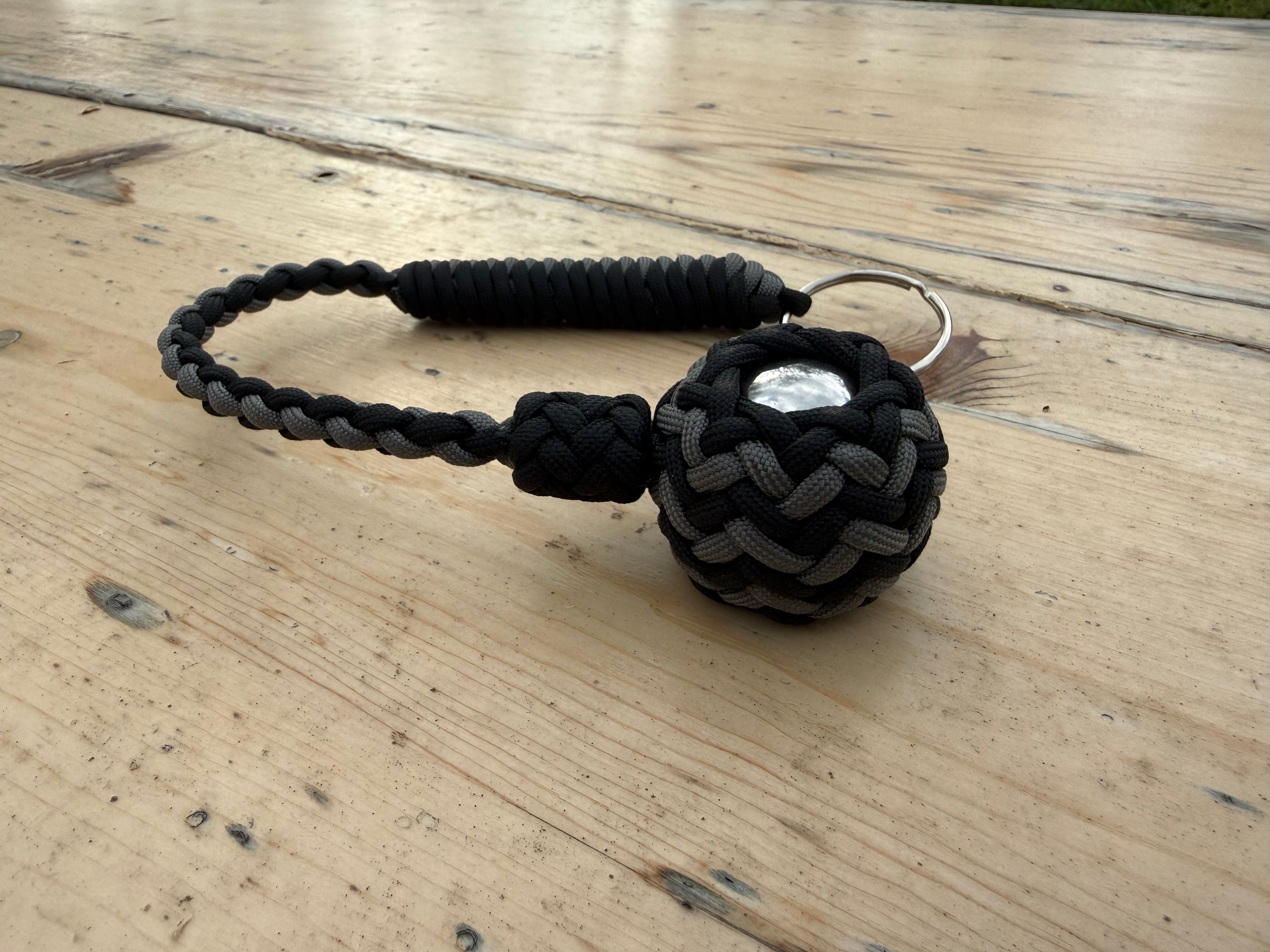 Decorative Paracord Wrapped 1.5 inch Steel Ball in Black and Charcoal Gray Keychain monkey fist style on a split ring