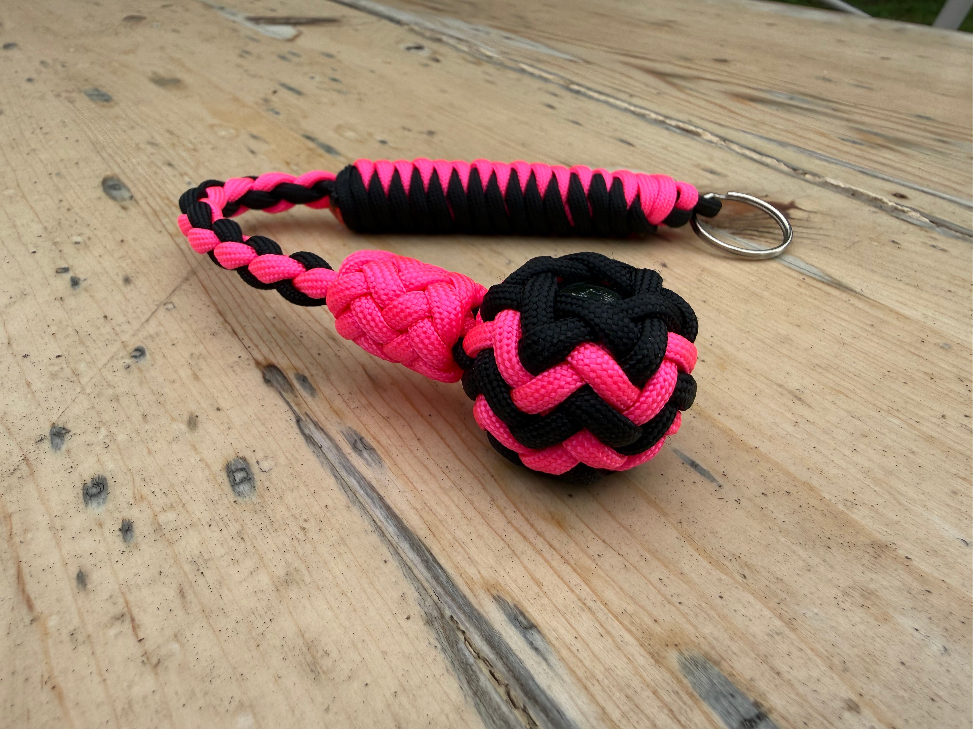 Decorative Paracord Wrapped 1 inch Steel Ball in Black and Neon Pink Keychain monkey fist style on a split ring