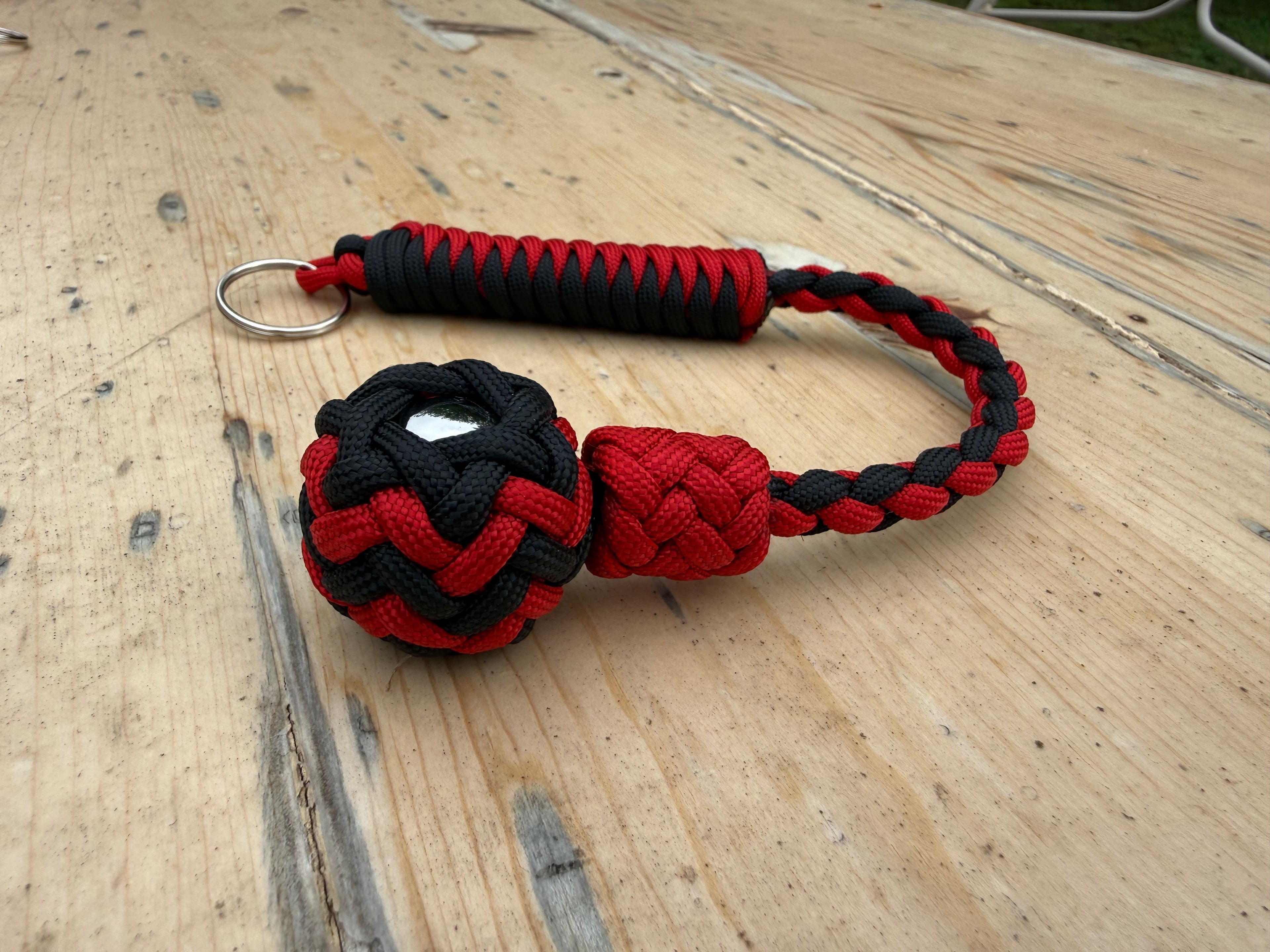 Decorative Paracord Wrapped 1 inch Steel Ball in Black and Red Keychain monkey fist style on a split ring